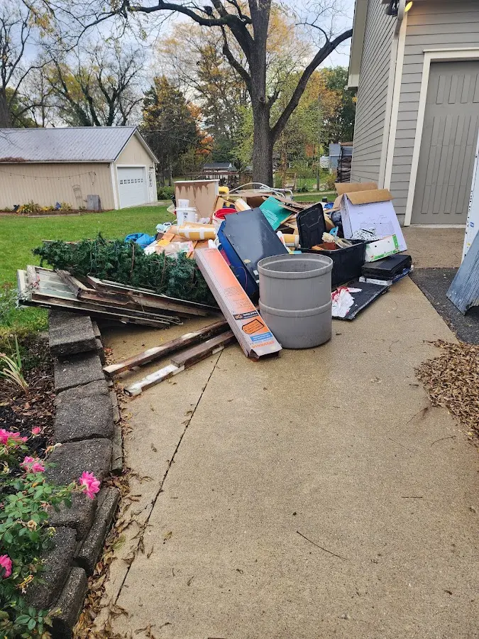 Dumpster being loaded with debris for Demolition Dumpster Rental in View Park-Windsor Hills